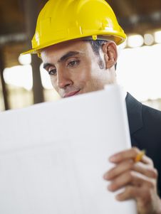 Architect With Blueprint In Construction Site Stock Photo Architect With Blueprint In Construction Site Stock Photo