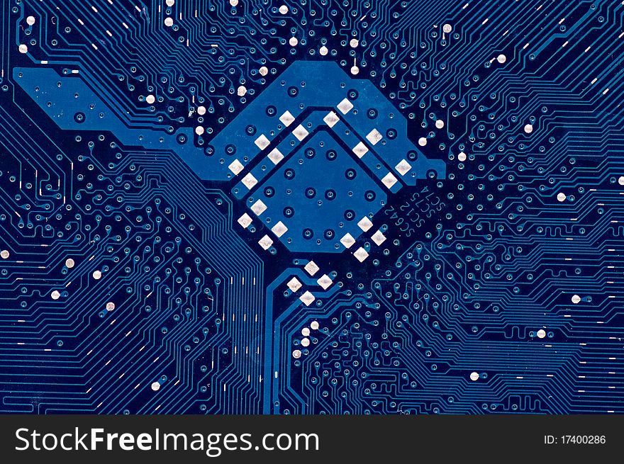 Close up of computer circuit board in blue