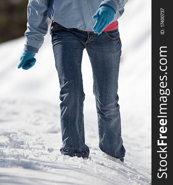 Woman Walking In Deep Snow