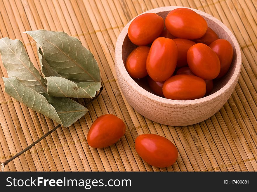 Cherry tomatoes in wooden bowl