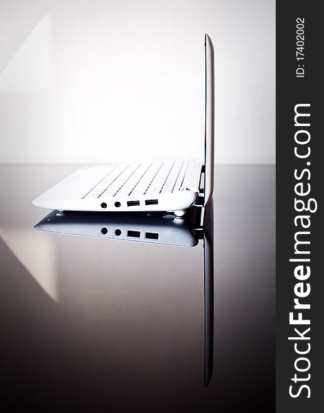 Modern netbook on black table