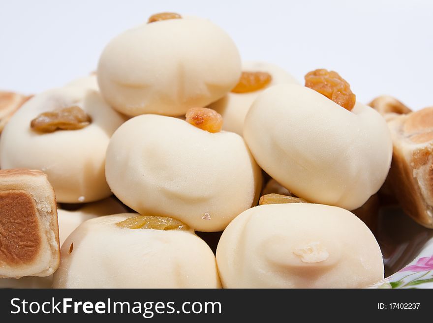 Thai dessert Moji Thai desserts and sweets to roll one more. Taste sweet. Arranged on the plate insert. On a white background. Thai dessert Moji Thai desserts and sweets to roll one more. Taste sweet. Arranged on the plate insert. On a white background.