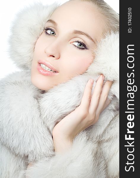 Portrait of young Beautiful girl wearing white fur. Portrait of young Beautiful girl wearing white fur