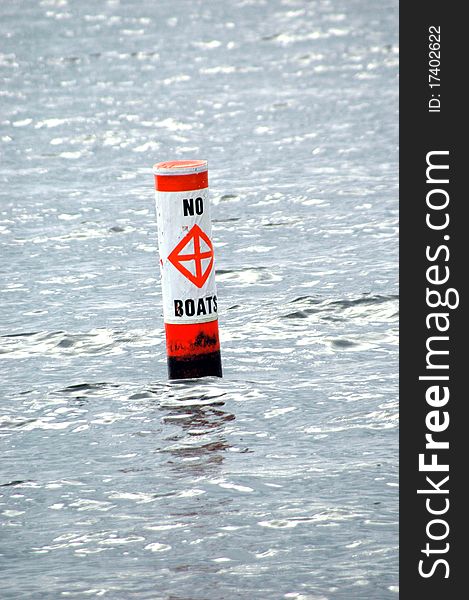 Boat warning buoy in the water.