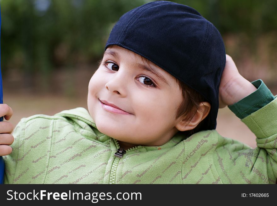 Portrait of beautiful smiling little boy in hat, outdoor shot. Portrait of beautiful smiling little boy in hat, outdoor shot