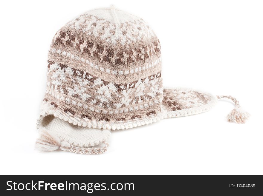 Warm knitted scarf and cap isolated on a white background