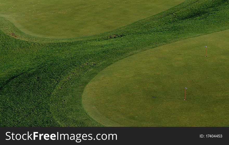 Two tones of green color, putting green practice area, useful picture for desktop wallpaper for golf lovers. Two tones of green color, putting green practice area, useful picture for desktop wallpaper for golf lovers