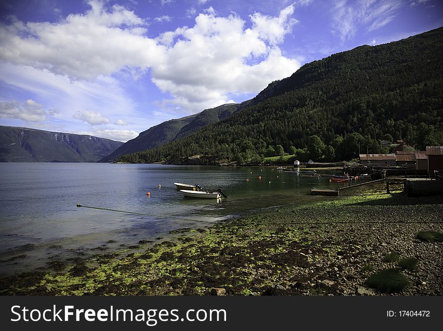 Boats on the fjord, Solvorn, Lustrafjorden, Norway, beautifull sunny day. Boats on the fjord, Solvorn, Lustrafjorden, Norway, beautifull sunny day