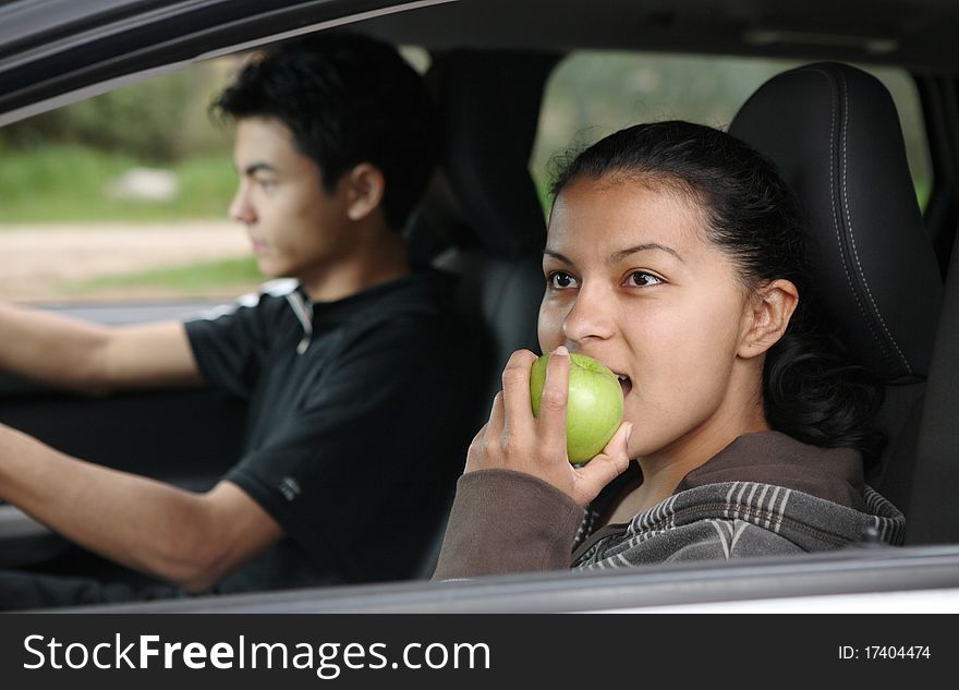 Young English in their brand new car going for a trip. Young English in their brand new car going for a trip