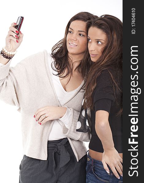 Two women taking pictures with cellphone