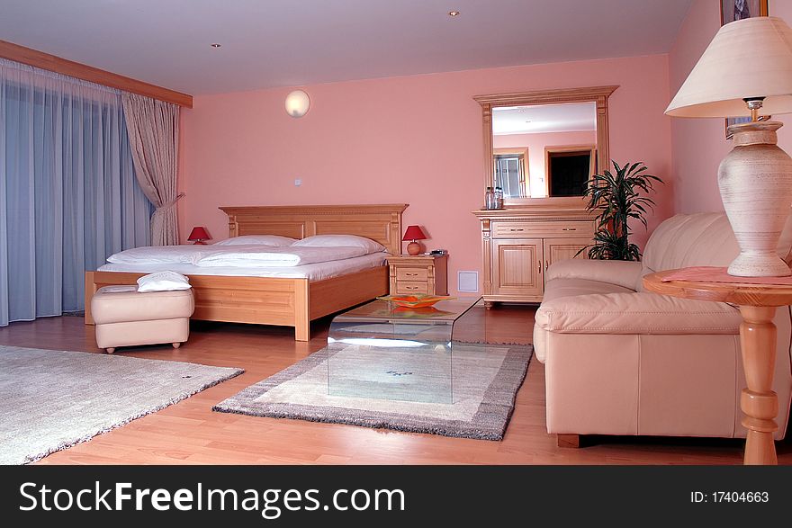 Hotel sleeping room with double bed, carpet, sofa and lamp. Hotel sleeping room with double bed, carpet, sofa and lamp