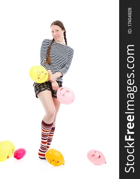 A pretty girl dressed in casual clothes playing with baloons. A pretty girl dressed in casual clothes playing with baloons