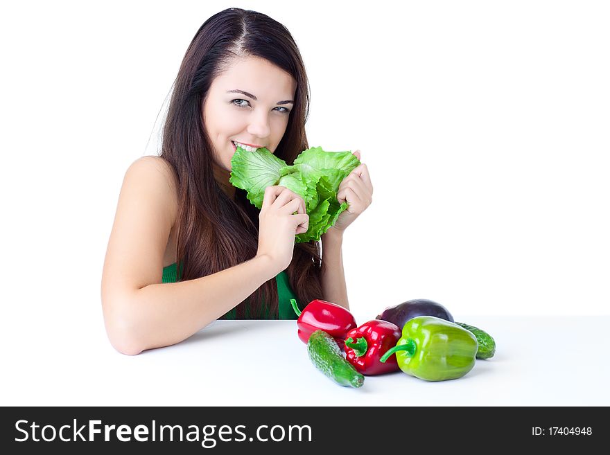 Young girl with  vegetables over white background