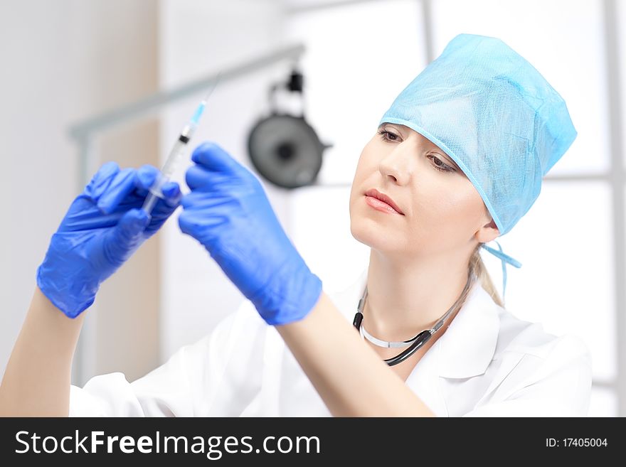 Woman doctor with blond hair in white. Woman doctor with blond hair in white