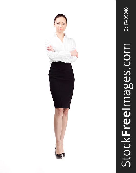 Attractive blonde woman in professional business suit standing sideways with arms crossed standing on white. Attractive blonde woman in professional business suit standing sideways with arms crossed standing on white