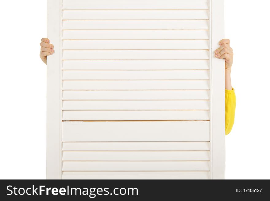 Llittle girl hides behind screen is isolated on the white