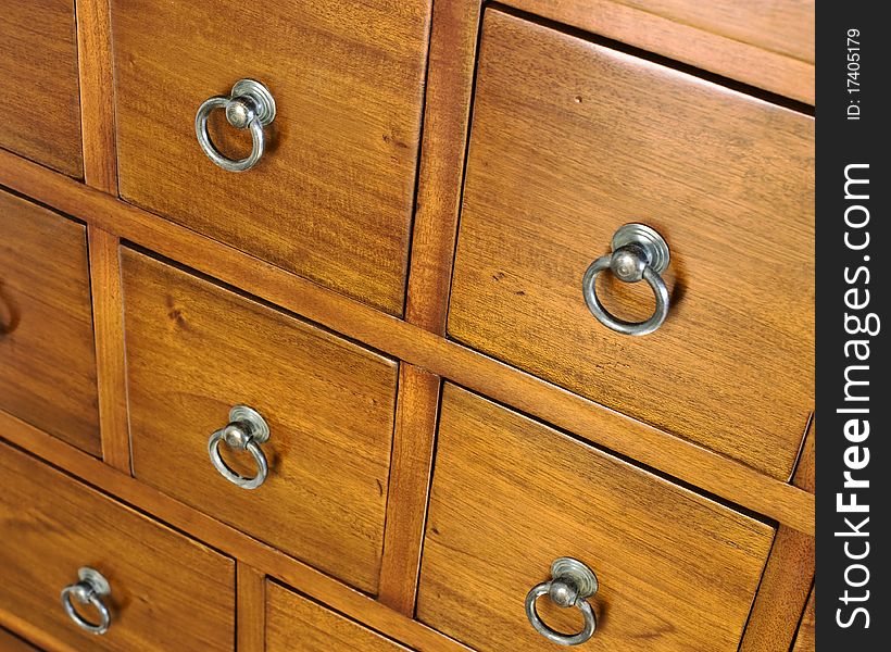 a background of wooden drawers in a chest of drawers