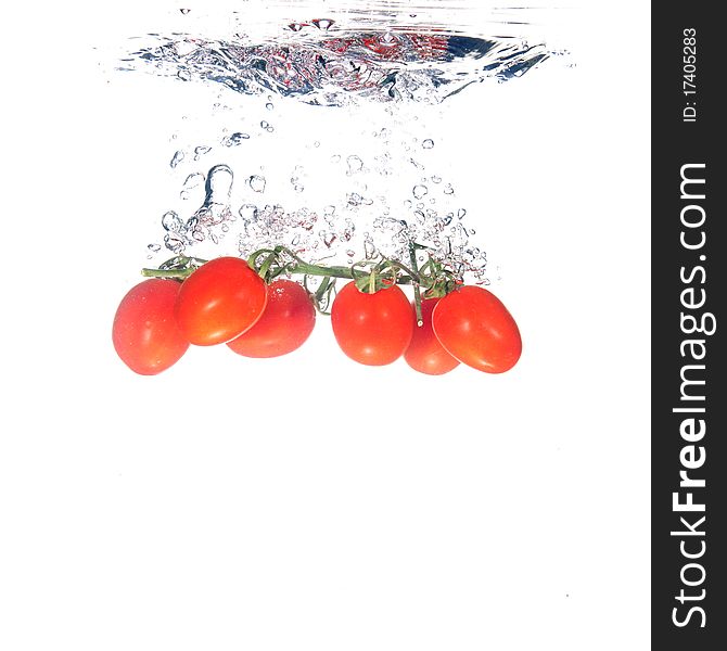 Tomatoes splash on white background