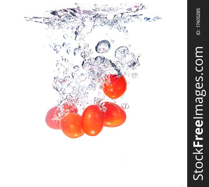 Tomatoes splash on white background