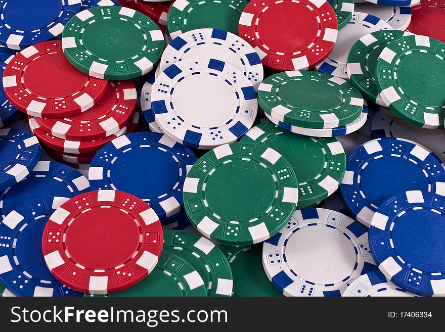 Red, blue, white and green poker chips