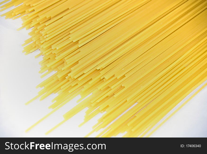 Yellow spaghetti on white background. Yellow spaghetti on white background