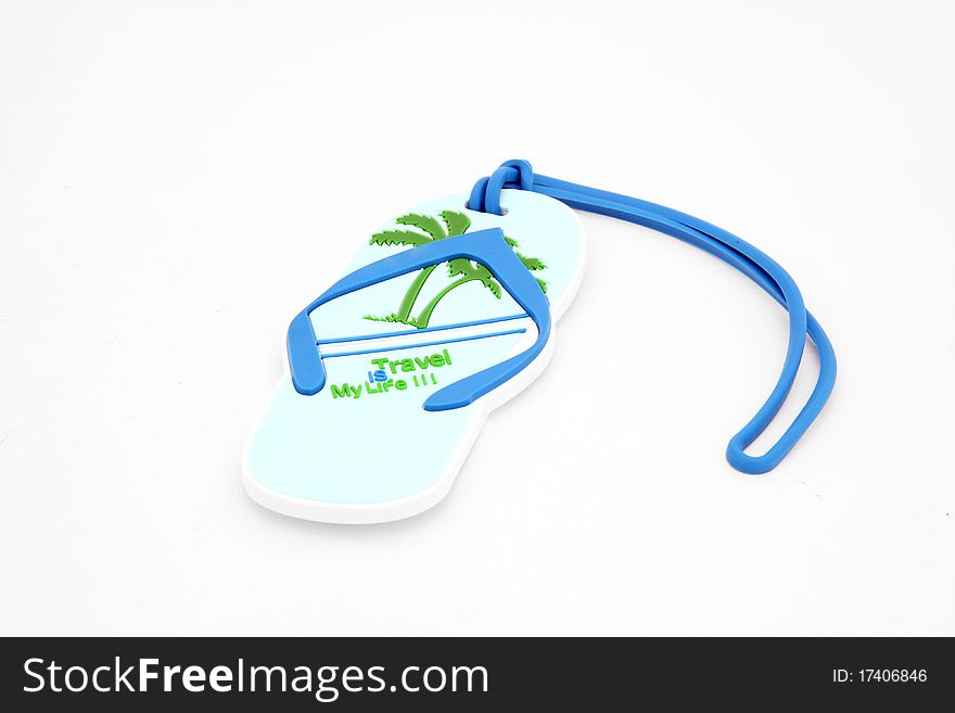 Isolated luggage name tag in sandal shape