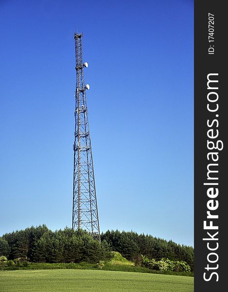An image of radio tower with satellite dish