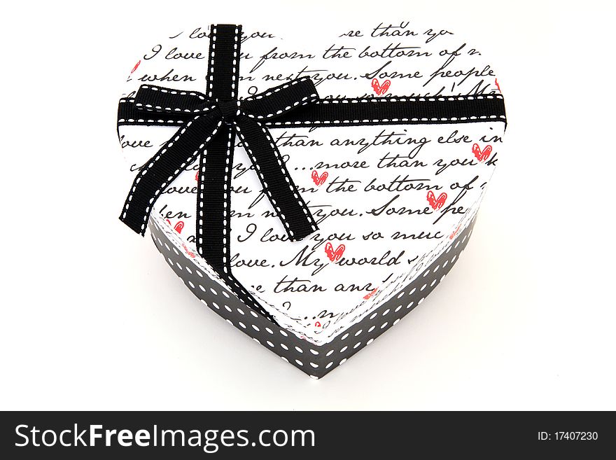 Isolated black and white holiday gift box in heart shape. Isolated black and white holiday gift box in heart shape