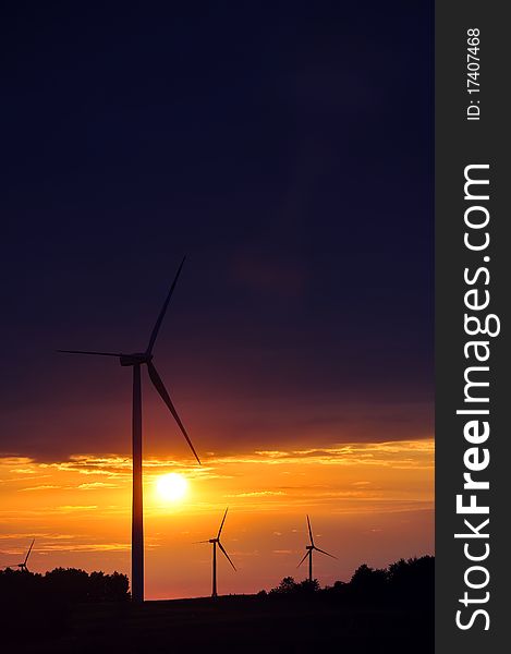 An image of Wind turbines during beautiful sunset