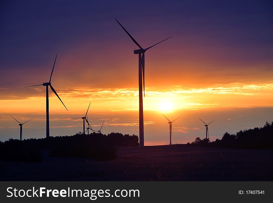 An image of Wind turbines during beautiful sunset
