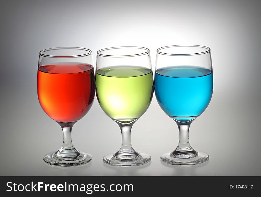 Red, green, and blue liquid in a glass separately. Red, green, and blue liquid in a glass separately