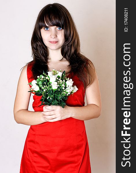 Beauty young woman with flowers in red dress