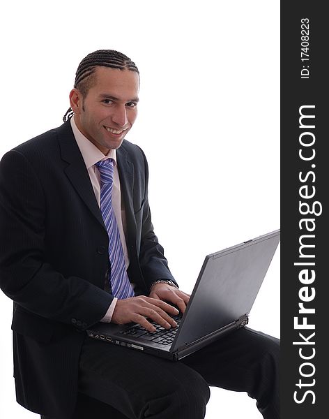 Photograph showing young business man isolated against white on laptop computer