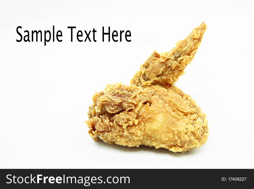 Isolated golden brown crispy fried chicken wing