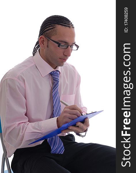 Photograph showing young business man isolated against white taking notes in shirt and tie