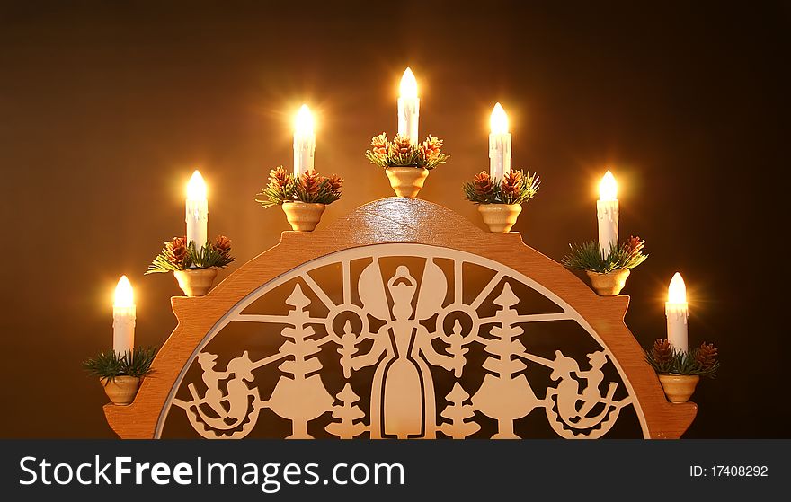 New Year's electric candles on the background of Christmas decorations