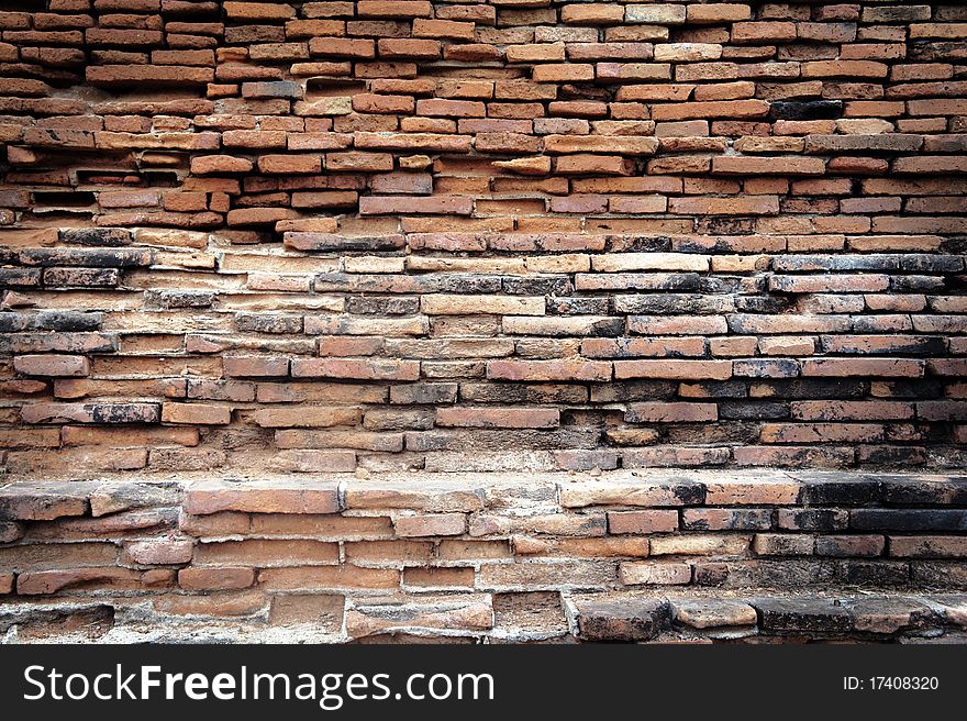 A detailed view of an old red brick wall. A detailed view of an old red brick wall.
