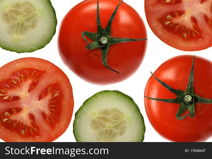 Tomatos and cucumbers isolated on white background