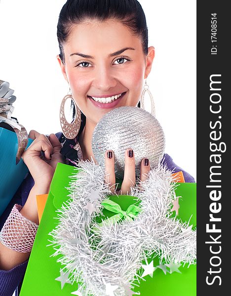 Happy girl with christmas decorations and bags, isolated. Happy girl with christmas decorations and bags, isolated