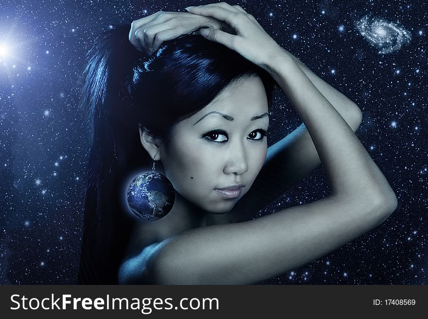 Portrait of cute female fashion model posing on dark background