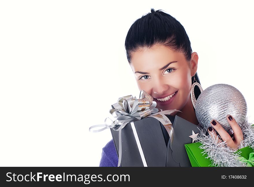 Happy girl with christmas decorations and bags, isolated. Happy girl with christmas decorations and bags, isolated