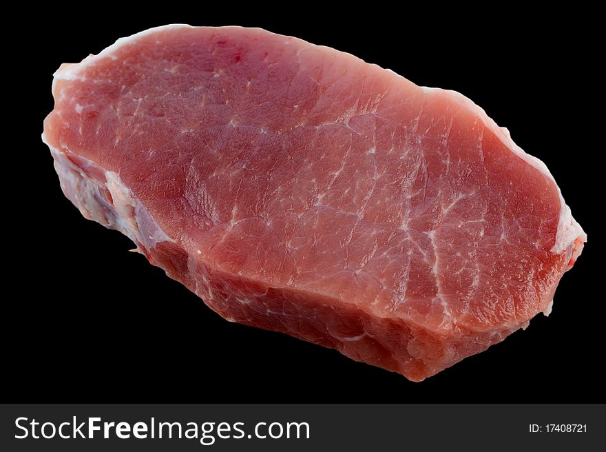Fresh pork loin chops isolation on a black background closeup
