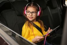 Cute Girl Listening To Audiobook In Car Stock Images