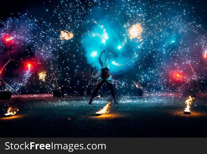 Fiery pieces of a fire show