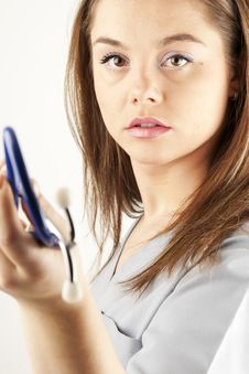 Young Woman Doctor Or Nurse Holding A Stethoscope Royalty Free Stock Image Young Woman Doctor Or Nurse Holding A Stethoscope Royalty Free Stock Image