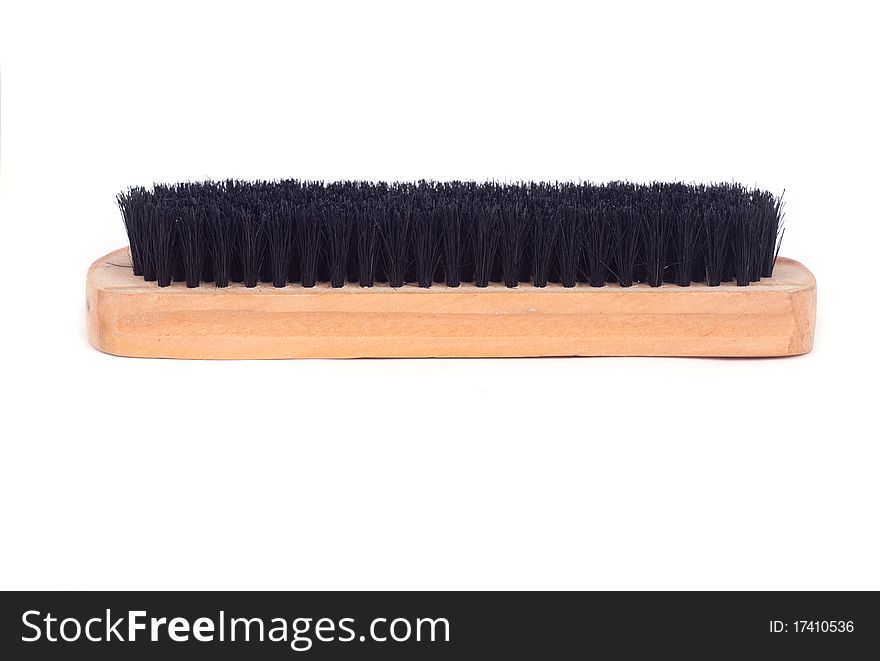 Brown wooden brush isolated on white background.