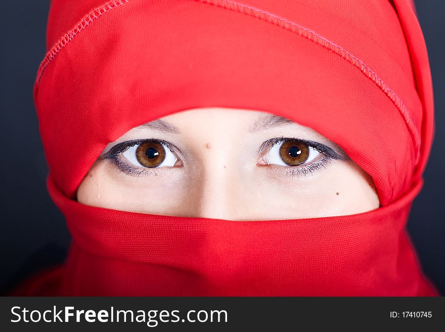 East woman in a red scarf