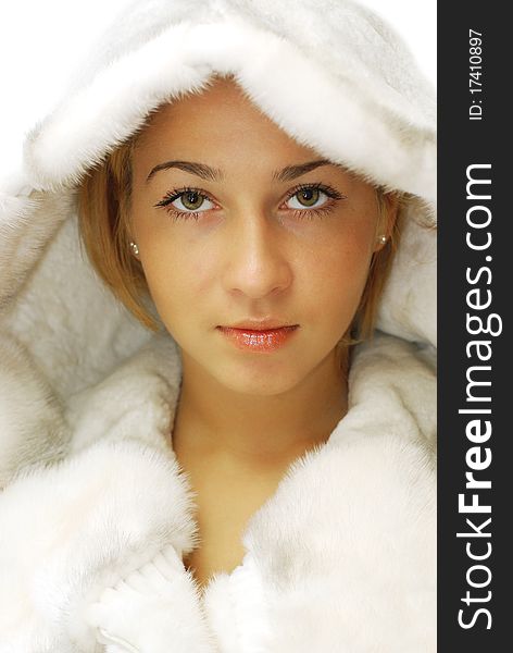 Portrait of attractive girl in a fur coat. Portrait of attractive girl in a fur coat
