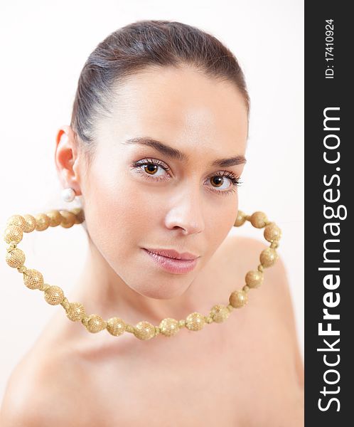 Portrait of the beautiful girl with a groundless beads. Portrait of the beautiful girl with a groundless beads