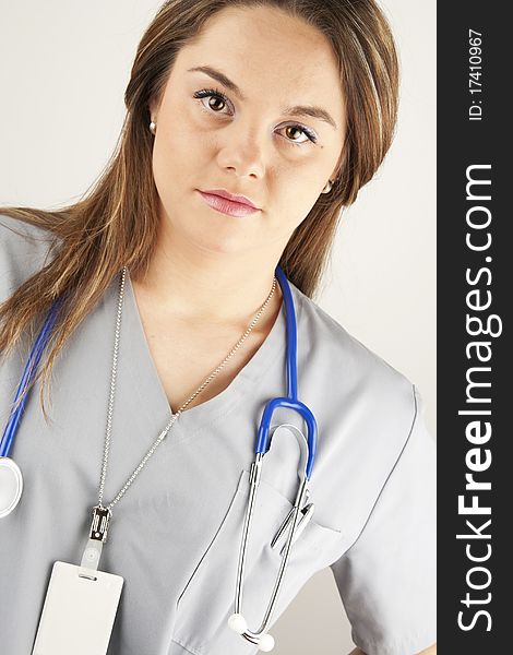 Young woman doctor or nurse wearing scrubs